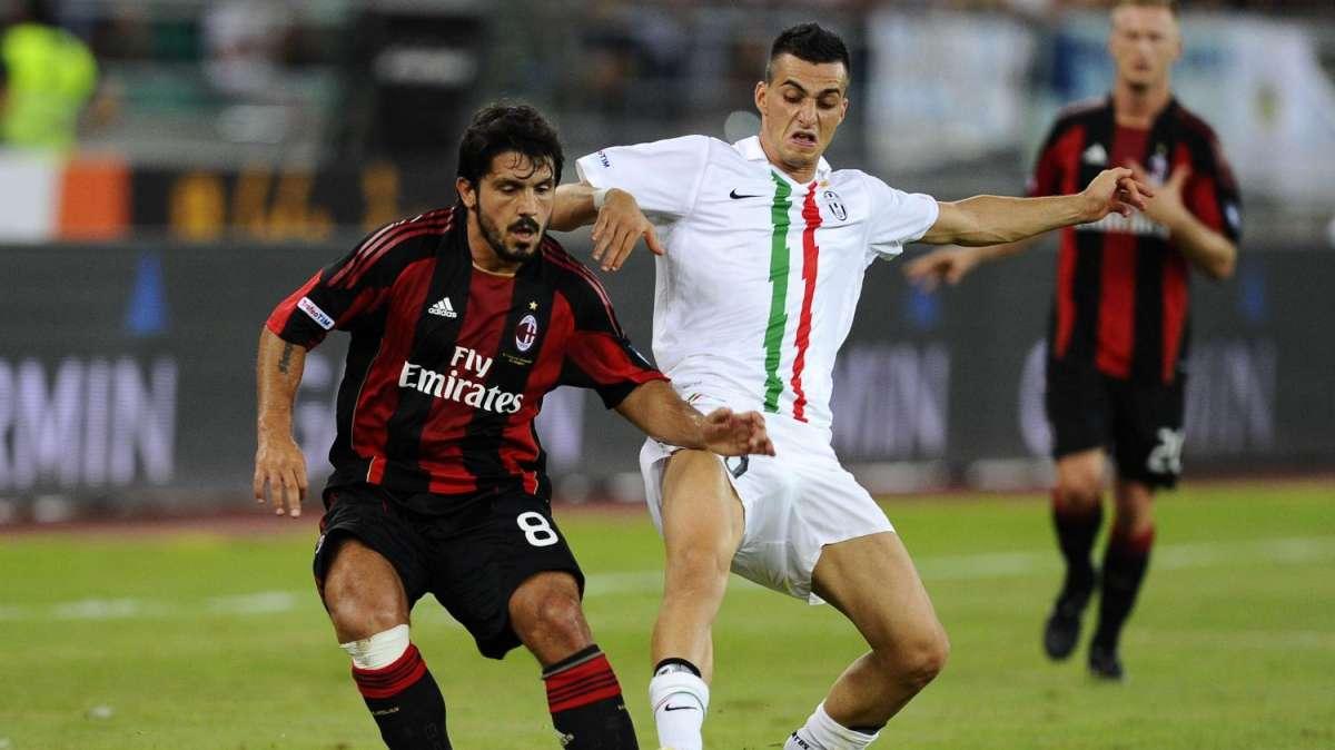 Davide Lanzafame 'lotta' con Gennaro Gattuso del Milan